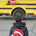 Young Child Waiting for School Bus