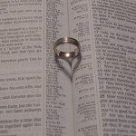 wedding band on open bible