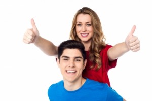 Couple giving thumbs-up